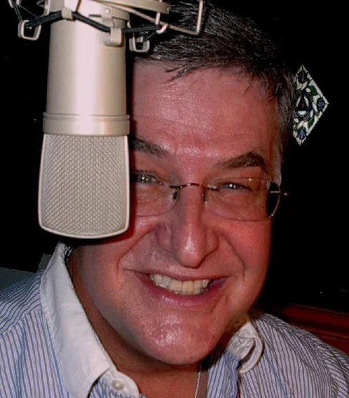 Micheal Ziants smiling at the Airlift microphone, from his 2012 promotional photograph