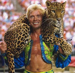 Gunther Gebel-Williams showing-off! Hey, it's his JOB.